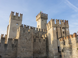 Fototapeta na wymiar The Scaliger Castle is a rare example of medieval port fortification, which was used by the Scaliger fleet. It' is the only point of access to the historic center of Sirmione.