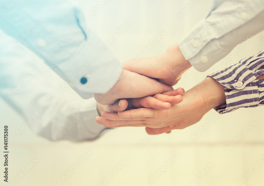 Aufkleber hands stacked in a pile. a symbol of teamwork and trust.