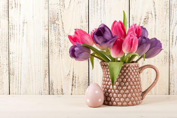 Easter egg and fresh tulips