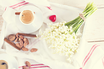 espresso, heart and bouquet of flowers