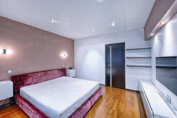 Russia, Moscow - modern designer renovation in a luxury building. Stylish bedroom interior with double bed