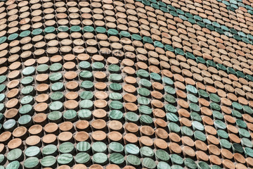 vietri sul mare (amalfi coast, italy):  colorful mosaic pattern on exterior facade, wave shape with pink and green circles elements