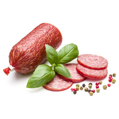 Salami smoked sausage, basil leaves and peppercorns isolated on white background cutout