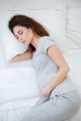 Vertical image of sleeping pregnant woman