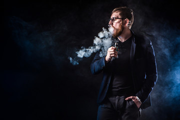 The man releases rings of smoke. Tricks with smoke.