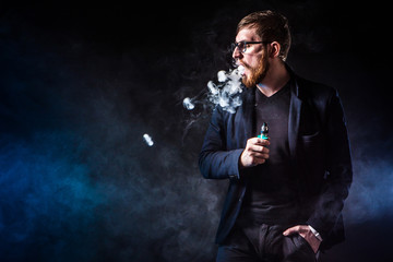 The man releases rings of smoke. Tricks with smoke.