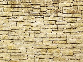 Yellow stone brick wall background