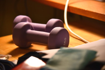 Dumbbell on Messy Table with Stuff