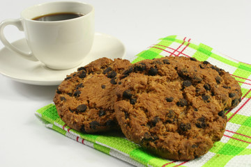 Coffee cup with oatmeal cookie chocolate on wooden background