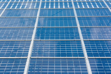 Obraz premium Solar Panels Closeup Blue Technology Clear Sunny Day Clouds Reflection Green Energy Real