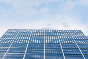 Fototapeta premium Solar Panels Closeup Blue Technology Clear Sunny Day Clouds Reflection Green Energy Real