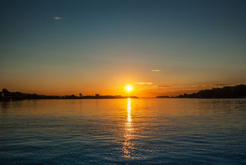 Beautiful sunset on the river, with blue sky and river