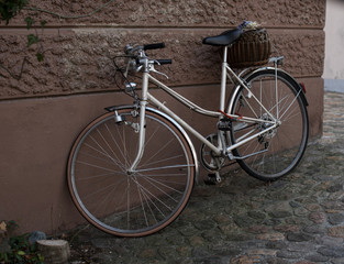 Public transport, bicycle parked at the wall