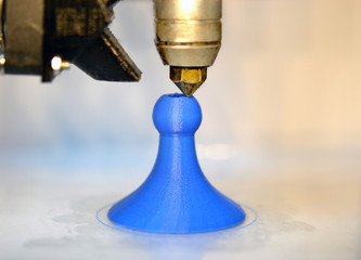 Modern 3D printer printing figure close-up macro.Automatic three dimensional 3d printer performs...