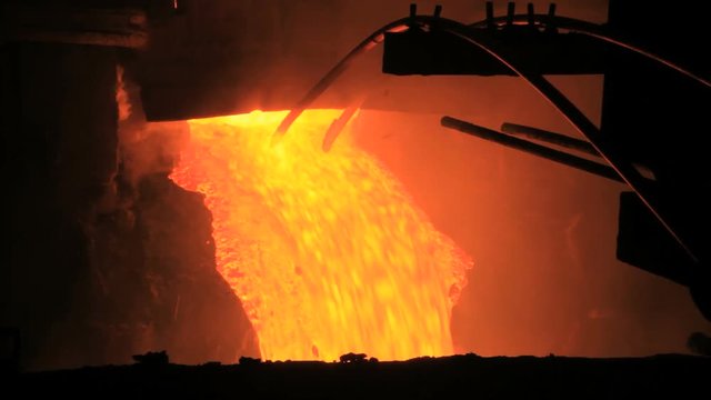 Molten metal pouring out of furnace. Liquid metal from blast furnace. Metallurgical industry process. Molten metal foundry. Pouring molten steel. Liquid steel pouring. Hot metal steel blast furnace - Powered by Adobe