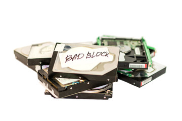 Stack of broken hard disk drives. Isolated