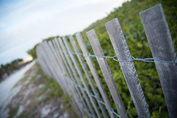 Wooden fence at Miami Beach with Pathway in Distance 