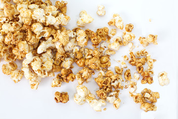 Unhealthy popcorn snacks on a white background