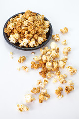 Unhealthy popcorn snacks on a white background