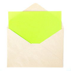 Blank color paper note in brown envelope isolated on white background
