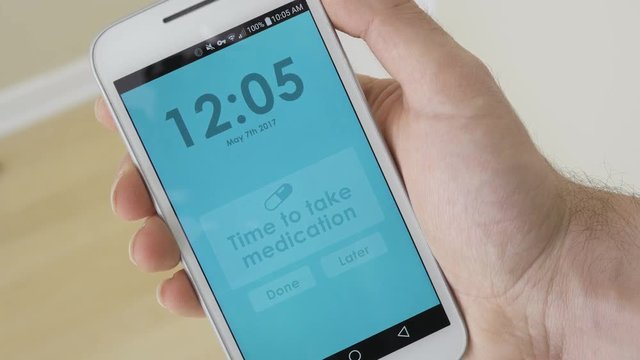 Smartphone showing a reminder to take medication.
