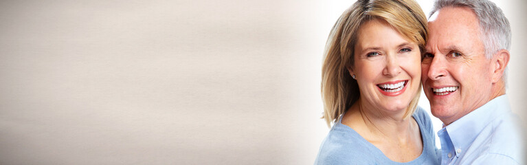 Senior couple smiling.