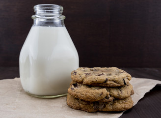 Chocolate Chip Cookies on Brown Paper with Milk