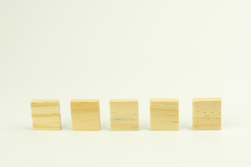 Row of five blank wooden blocks on a white background with copyspace for your text