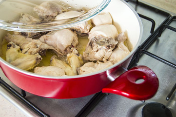 Chicken cooked in oven, chicken cooked in the style of chicken, chopped chicken, chicken pieces, chicken pieces in pots, raw chicken

