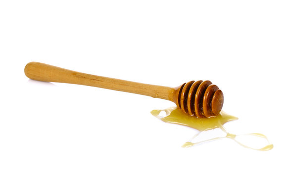 wooden honey dipper with honey