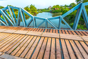 wooden bridge across canal
