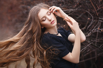 Fototapeta premium Beautiful girl portrait with a fish in her hands