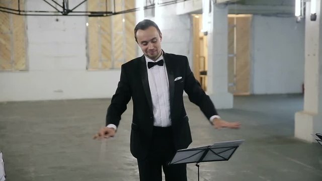Conductor of classical orchestra, symphonic orchestra, music director