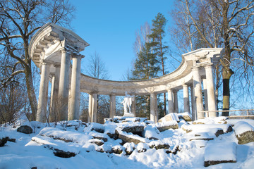 View of the colonnade of Apollo in Pavlovsk palace park on a sunny February day. Saint-Petersburg