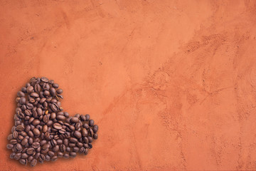 Coffee beans in form of heart on beautifull background. Love. Insparation. On concrete background.