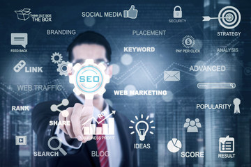 Businessman touching SEO button