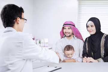Family visits a pediatrician in the clinic