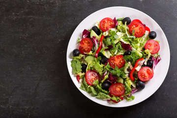 plate of fresh salad with vegetables