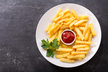 Plate of french fries with ketchup