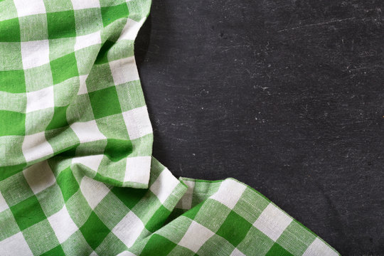 Green Checkered Tablecloth On Dark Table