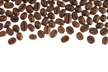 Heap roasted coffee beans as decorative border with copy space isolated on white background.