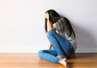 girl are afraid sitting on white background