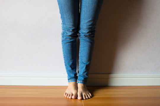 woman legs with blue jean on white background