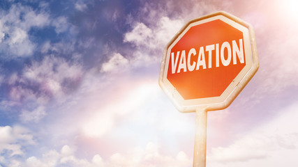 Vacation, text on red traffic sign