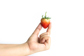 Fresh strawberry in hand