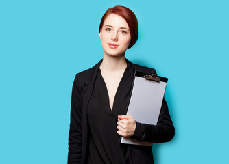 beautiful young woman with clipboard on the wonderful blue background