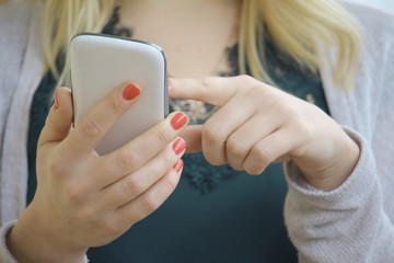 woman fingers on cell phone with touch technology