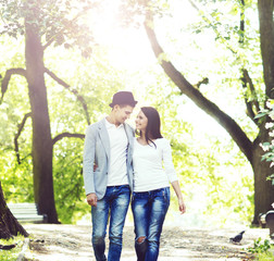 Fototapeta premium Young beautiful couple: walking in the park. Love, relationship, dating: concept.