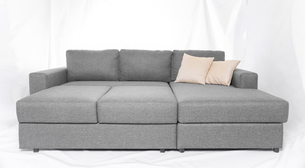 Studio shot of a grey modern sofa isolated on white background