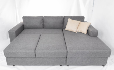 Studio shot of a grey modern sofa isolated on white background